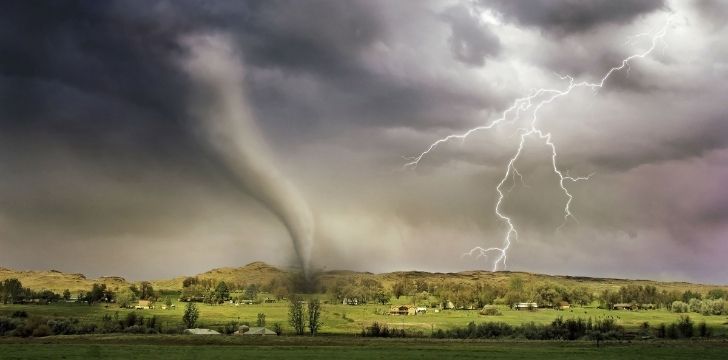 a dramatic tornado with lightening right next to it