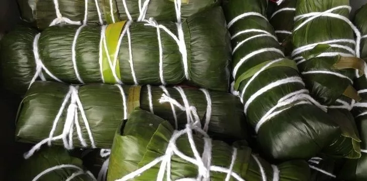 Beans wrapped in banana leaves