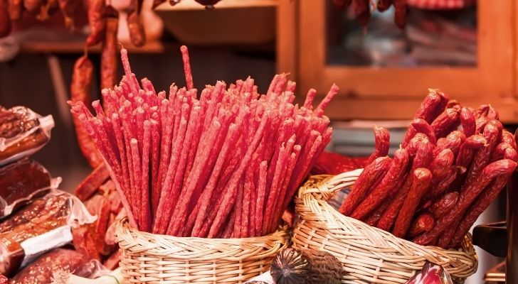 Thin sausage sticks in baskets