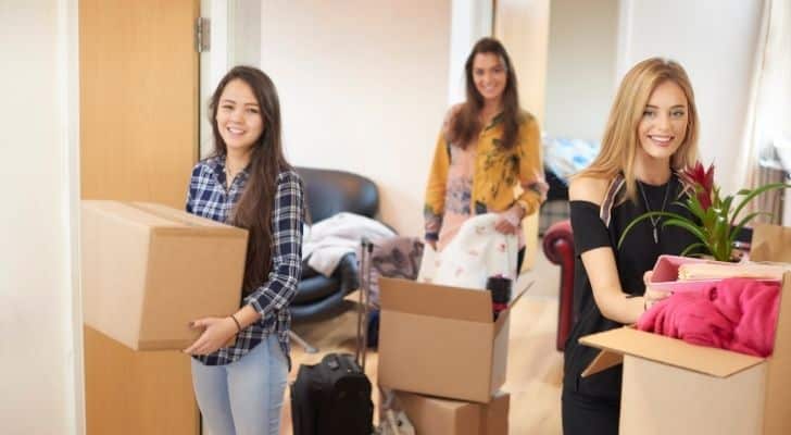 Three women moving into a house together