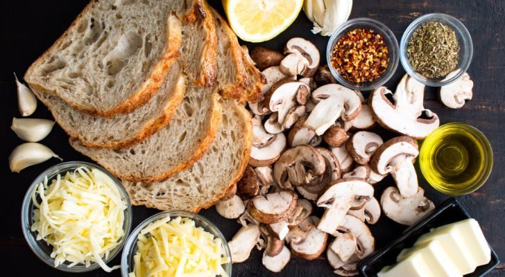 The makings of a grilled cheese sandwich with mushrooms and garlic