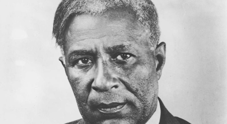 Garrett Morgan, who invented the concept behing yellow traffic lights, staring into the camera