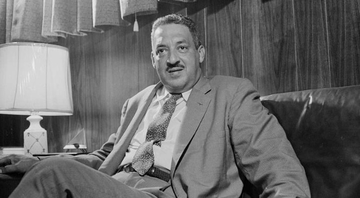 Thurgood Marshall sitting in an office