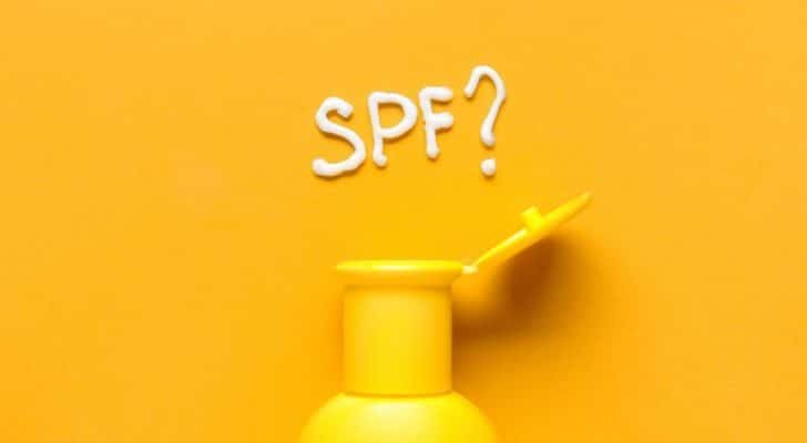 The letters "SPF" spelled out in sunscreen