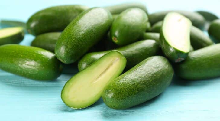 A pile of ripe, seedless avocados