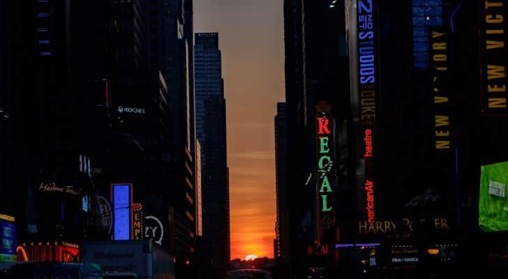 the Manhattanhenge phenomenon, with the sun setting between buildings in Manhattan