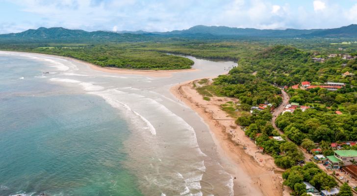 A wide river flows into the sea in Costa Rica.