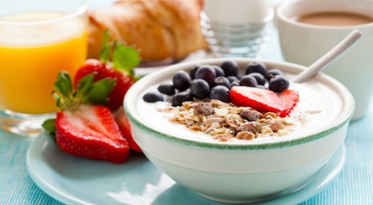 A varied breakfast comprising cereal, fruit and egg and more