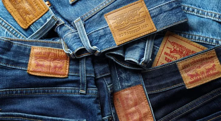 A pile of Levi's jeans showing their Levi Strauss "Two Horse Patch"