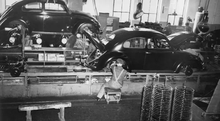 An assembly line in a factory making cars