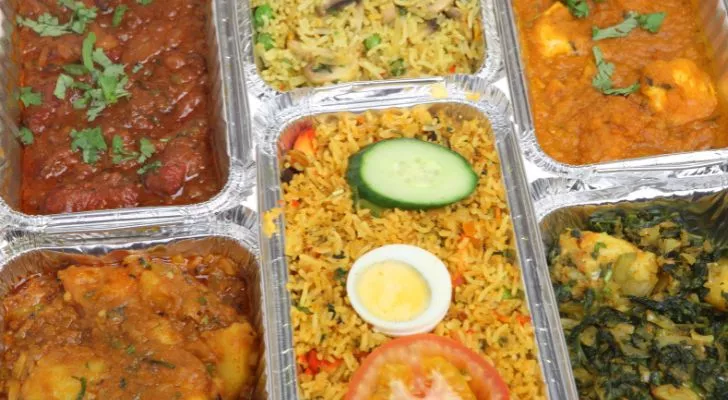 An assortment of Indian takeaway dishes arranged together