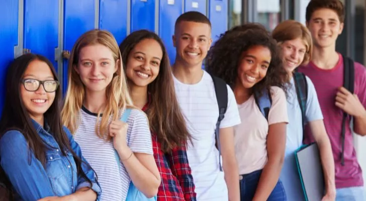 A group of friends at an American school wearing their own choice of clothes rather than a uniform