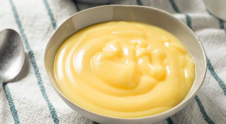 A bowl of bright yellow custard