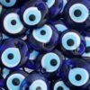 A collection of blue Nazar, or evil eye charms, commonly used for protection in various cultures.