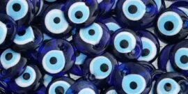 A collection of blue Nazar, or evil eye charms, commonly used for protection in various cultures.