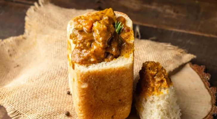 bunny chow, a hollowed out half-loaf of bread filled with curry