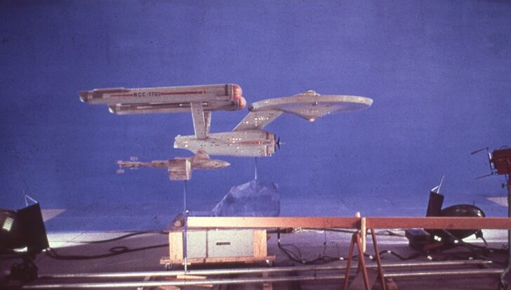 The model of the original Enterprise from Star Trek displayed against a blue background