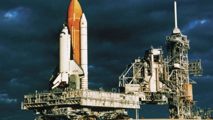 NASA's first space shuttle Enterprise on the launch pad against a dark sky