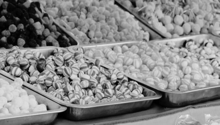 Assorted hard candies in metal trays