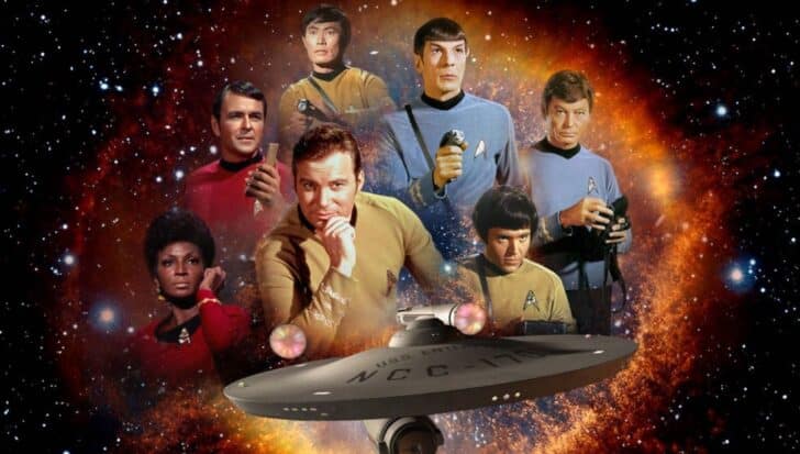 The original Star Trek cast members, including Captain Kirk, Spock, and Uhura, with the USS Enterprise in space