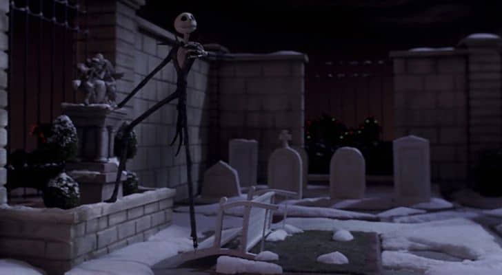 Jack Skellington standing in a snowy graveyard