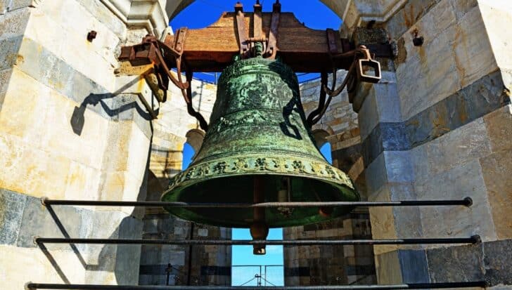 Large bell inside the Leaning Tower of Pisa, noted for its significant weight