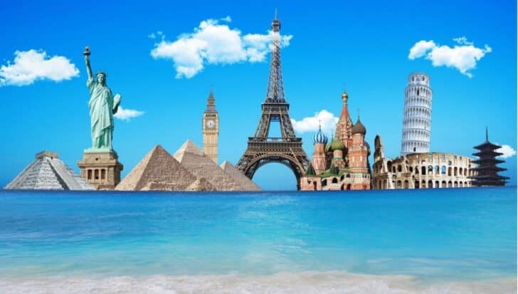 Collage of famous landmarks including the Leaning Tower of Pisa, the Eiffel Tower, Big Ben, the Statue of Liberty, pyramids, Colosseum, Saint Basil's Cathedral, and a pagoda along a serene seascape