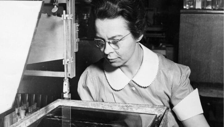 Katharine Blodgett working with scientific equipment