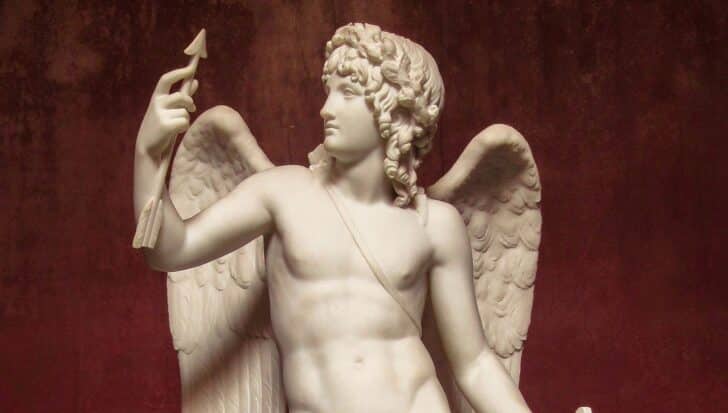 Marble statue of Cupid holding an arrow, related to Valentine's Day themes